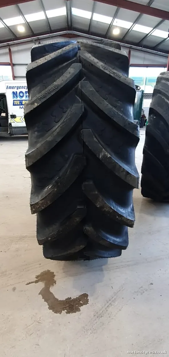 Large tractor tyres standing in the Nortons Tyres workshop, close view Large tractor tyres standing in the Nortons Tyres workshop, close view