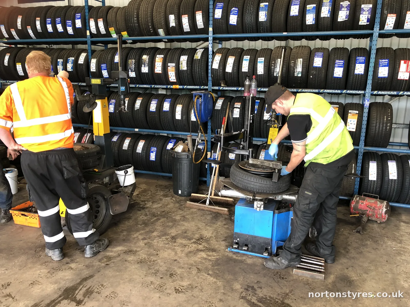 Car tyre being removed from the wheel on the tyre changer Car tyre being removed from the wheel on the tyre changer