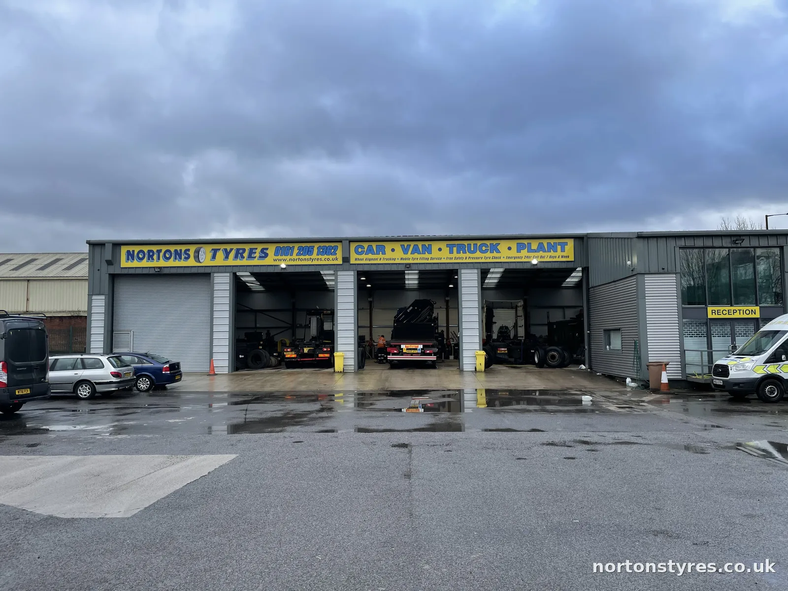 Front of the Nortons Tyres building with the bay doors open Front of the Nortons Tyres building with the bay doors open