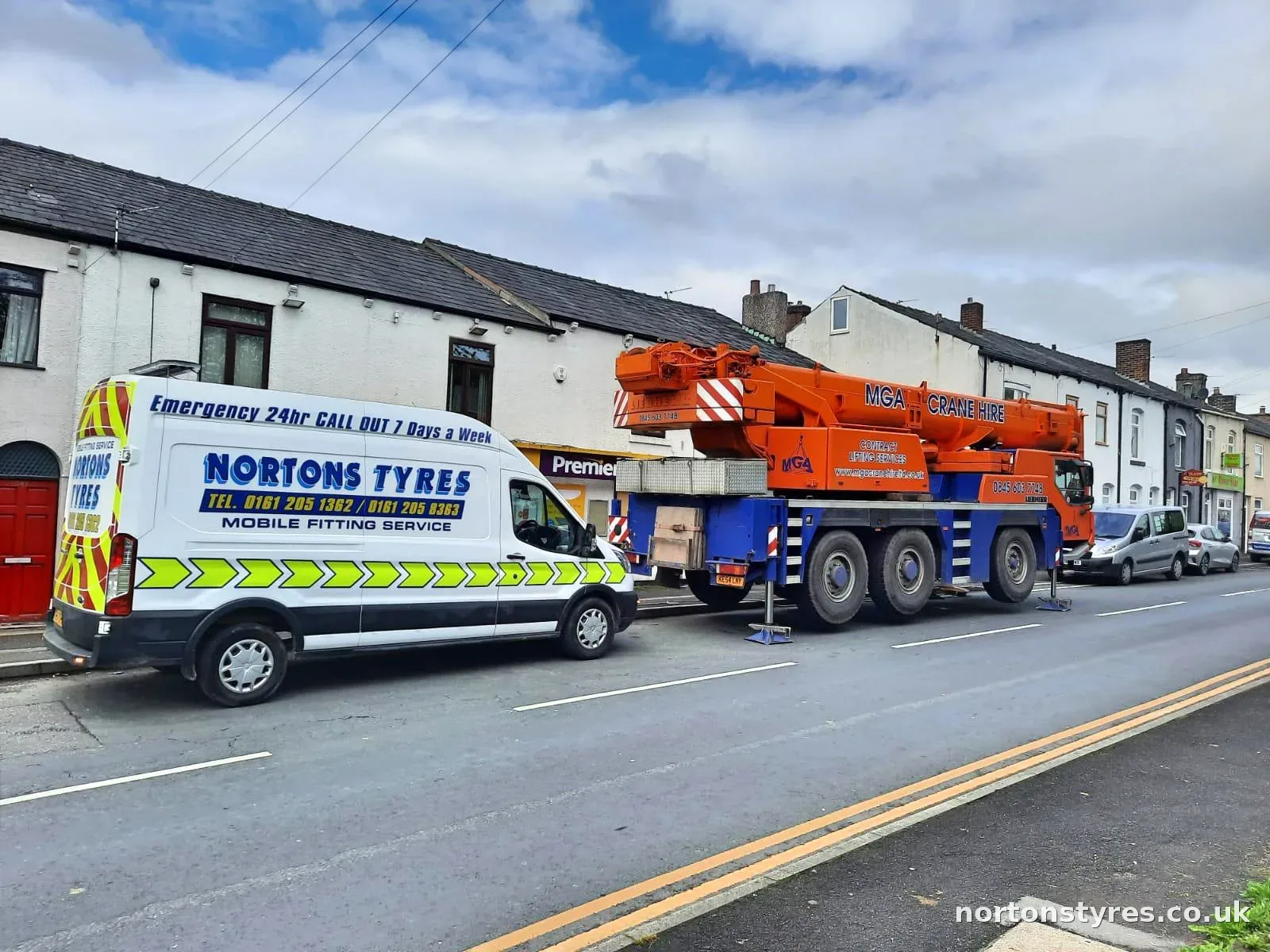 Nortons Tyres mobile fitting van parked beside a mobile crane Nortons Tyres mobile fitting van parked beside a mobile crane