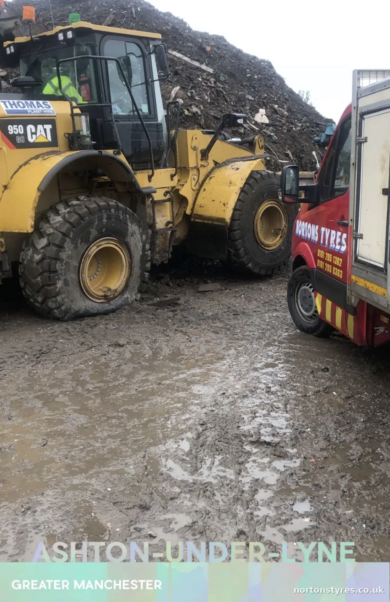 Loading shovel with a Nortons Tyres van in attendance in Ashton-under-Lyne Loading shovel with a Nortons Tyres van in attendance in Ashton-under-Lyne