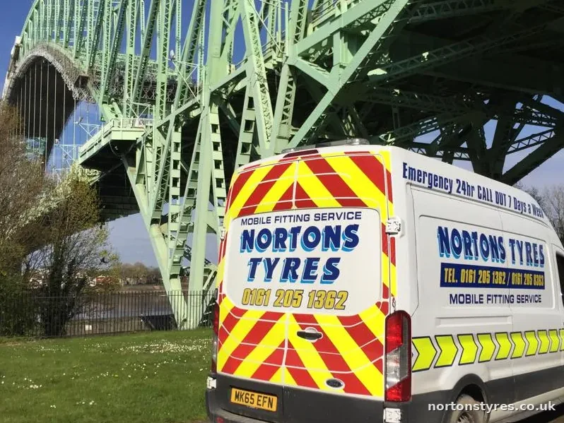 Nortons Tyres mobile fitting van parked by a river bridge, close view Nortons Tyres mobile fitting van parked by a river bridge, close view
