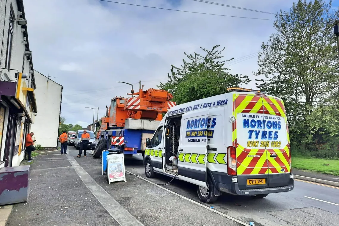 Nortons Tyres 24 hour mobile tyre fitting van attending a roadside crane tyre call out in Manchester
