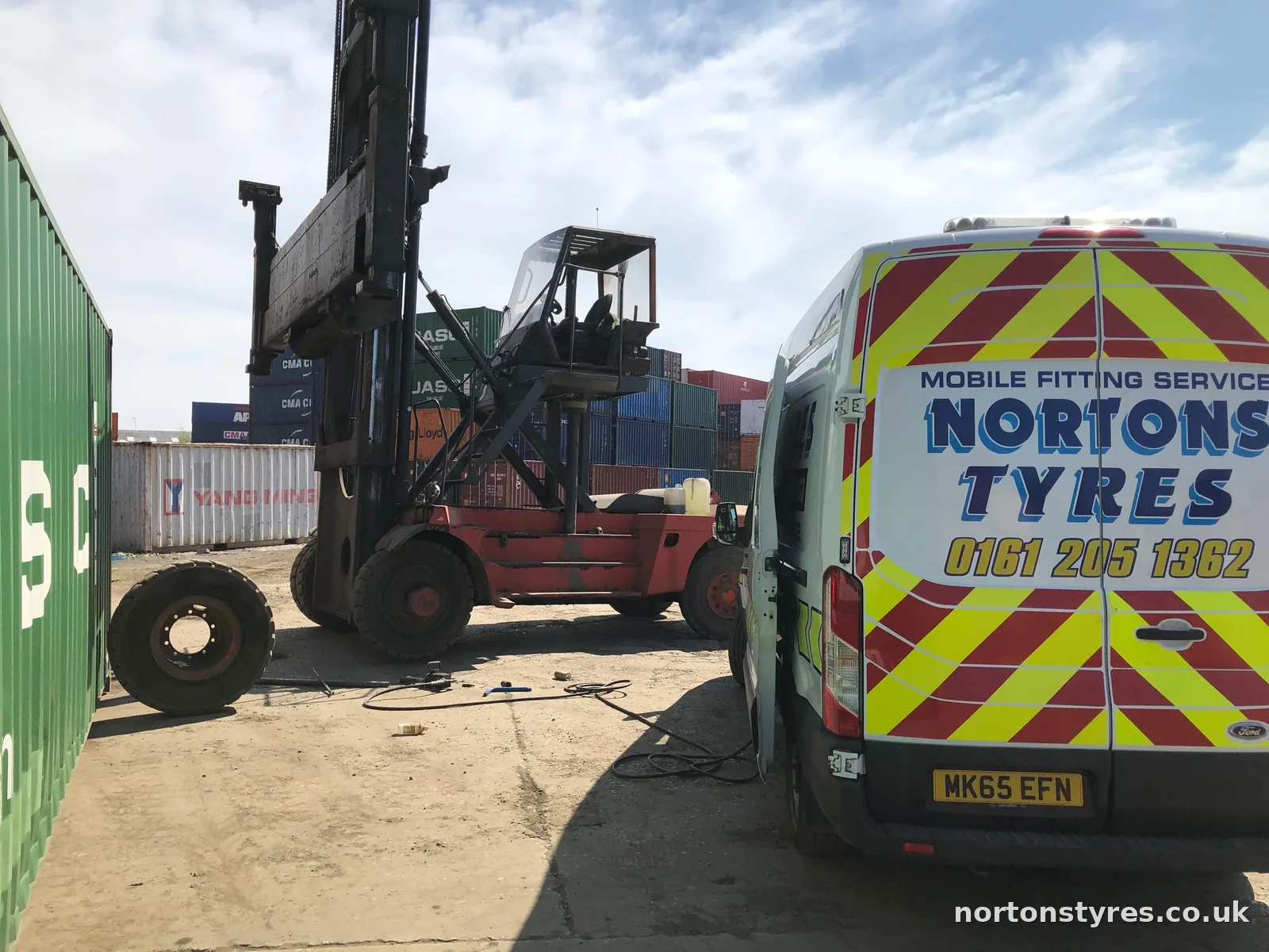 Nortons Tyres van attending a forklift in a container yard Nortons Tyres van attending a forklift in a container yard