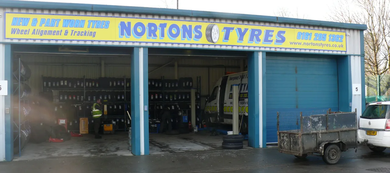 Nortons Tyres tyre bay on Norton Street, Miles Platting, Manchester
