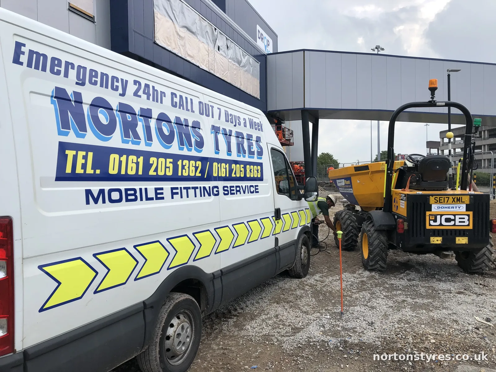 Nortons Tyres van on site beside a JCB dumper Nortons Tyres van on site beside a JCB dumper