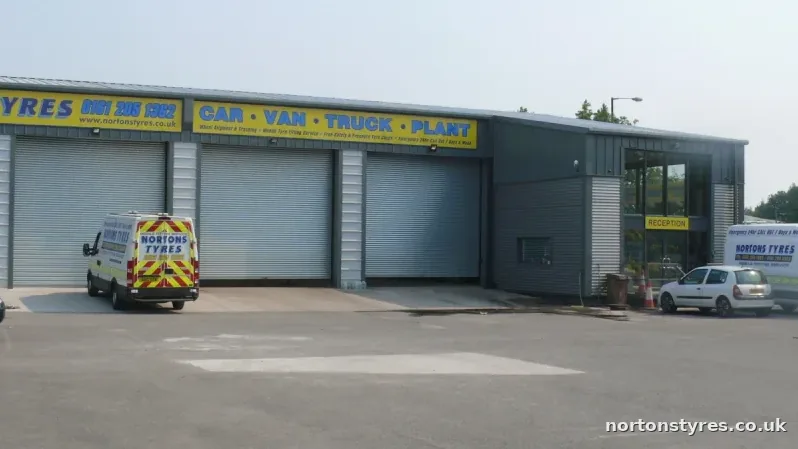 Nortons Tyres building and roller doors from the yard, close view Nortons Tyres building and roller doors from the yard, close view