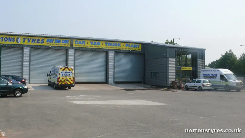Nortons Tyres building and roller doors from the yard Nortons Tyres building and roller doors from the yard