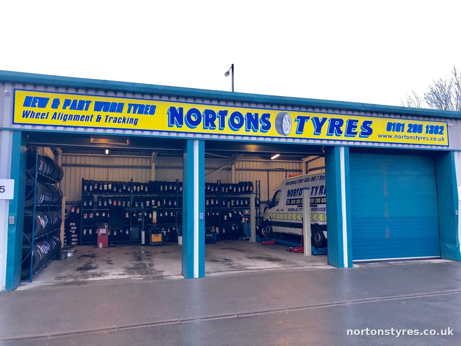 Nortons Tyres car bay with tyre racks inside Nortons Tyres car bay with tyre racks inside