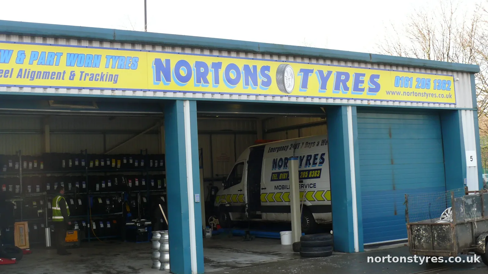 Nortons Tyres bay with a mobile van inside, close view
