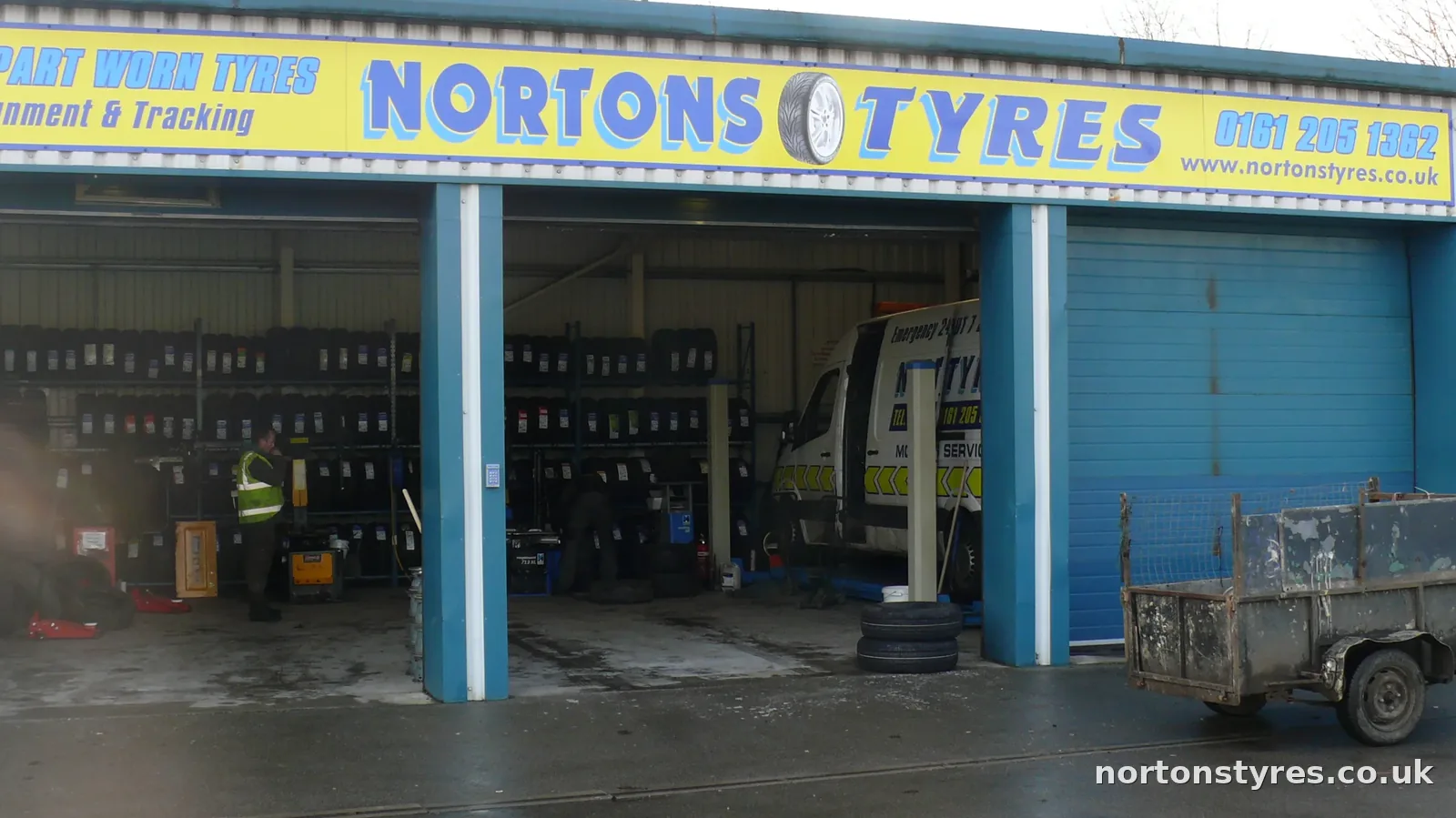 Nortons Tyres car bays on a wet day, close view Nortons Tyres car bays on a wet day, close view