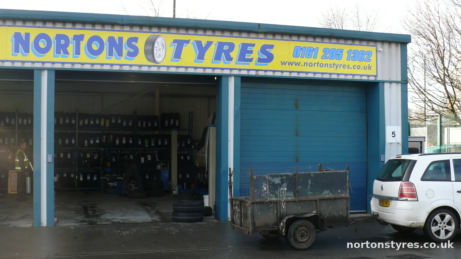 Nortons Tyres bays and sign, close view Nortons Tyres bays and sign, close view