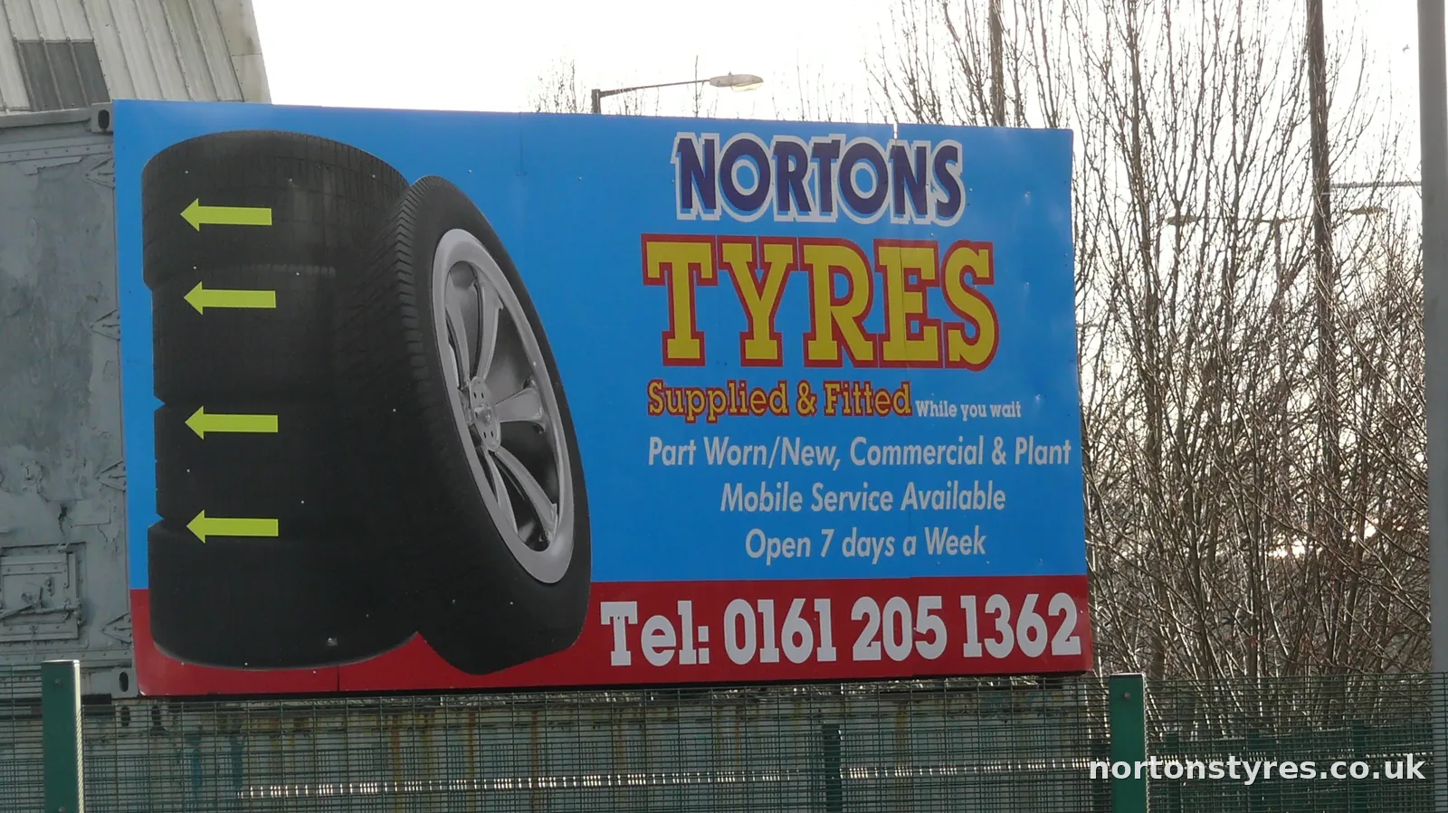 Nortons Tyres sign by the roadside, close view Nortons Tyres sign by the roadside, close view